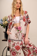 Calça Pantalona Com Abertura Em Uma Perna Bege Estampado Yacamim A7